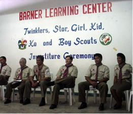 Scout leaders sitting on stage