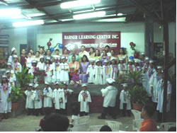Large group of children in graduation gowns